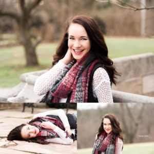 Senior wearing red, black, and white smiles for the camera during her senior picture session in Pittsburgh and Wexford, PA